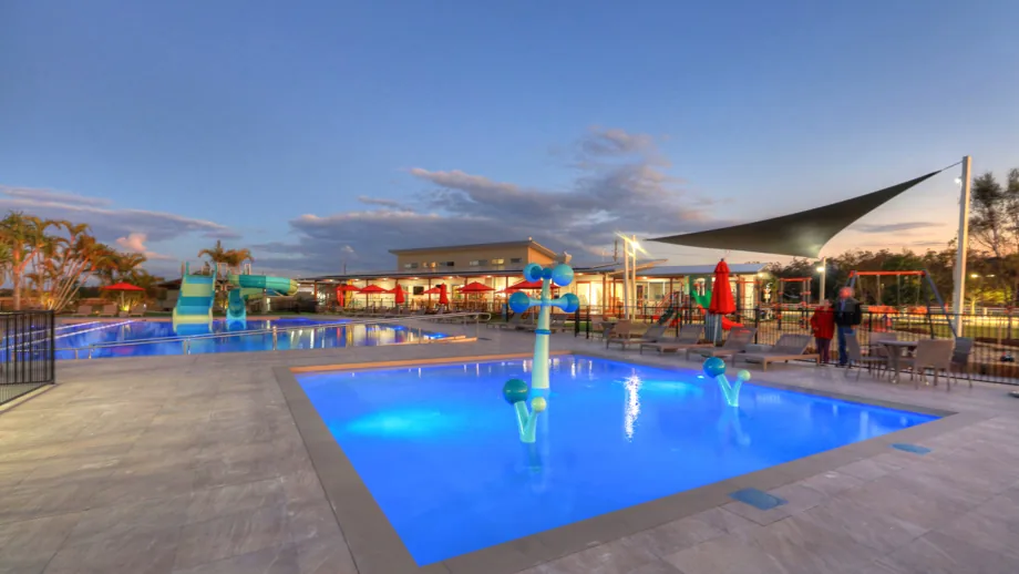 Rivershore Resort pool and waterslide precinct at dusk